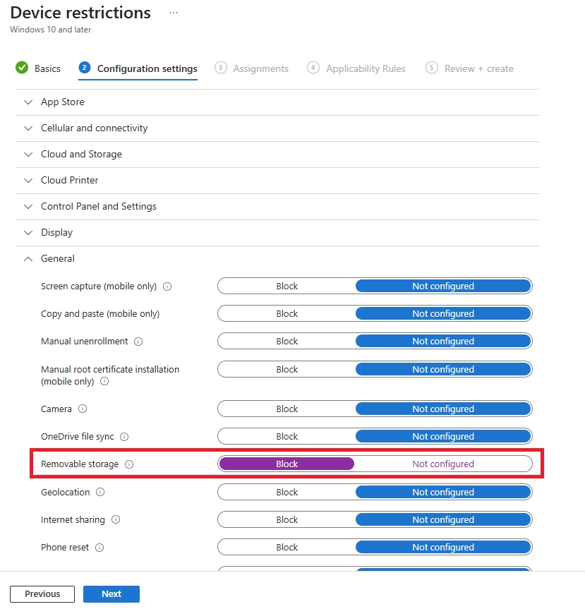 Device restrictions configuration showing removable storage setting set to Block.